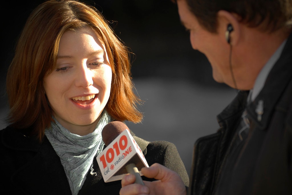 CBC Radio interview with microphone flag